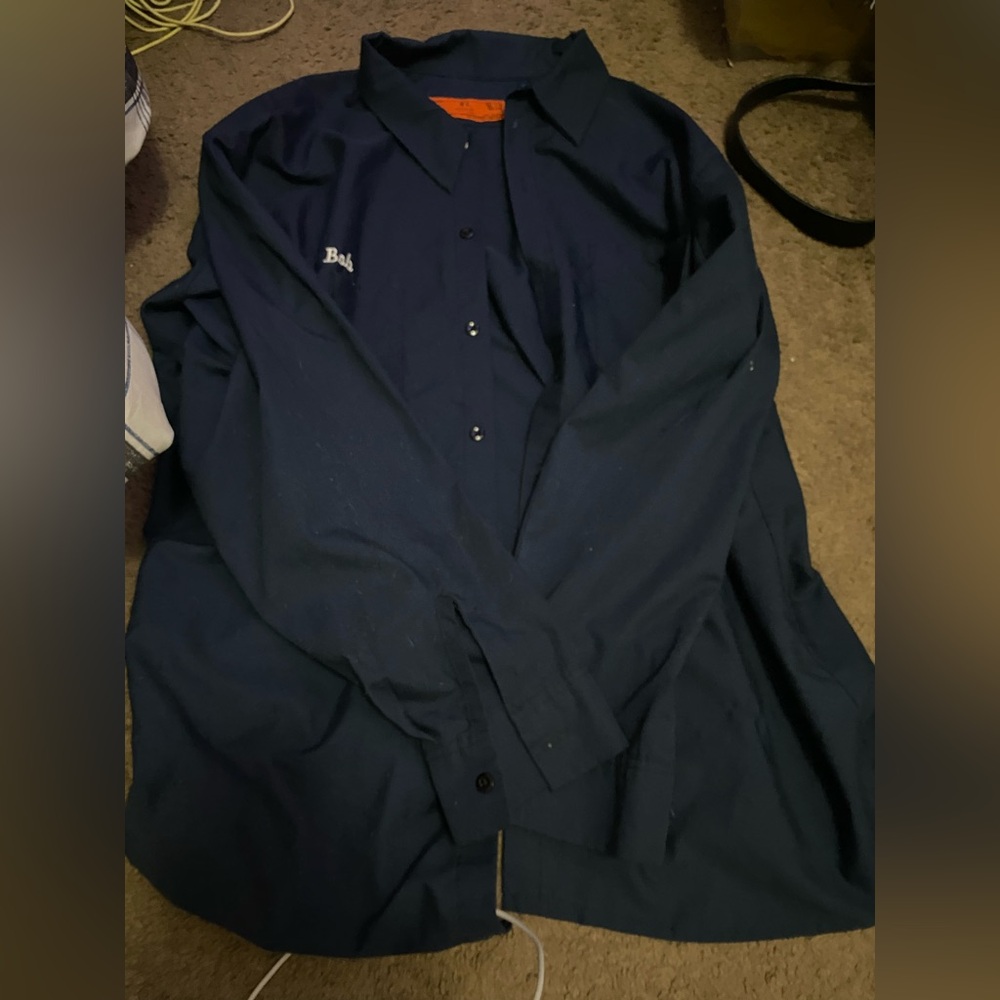 Size: XL
Brand: CCR
Style: Dark blue button up, metal buttons, “Bob” name tag